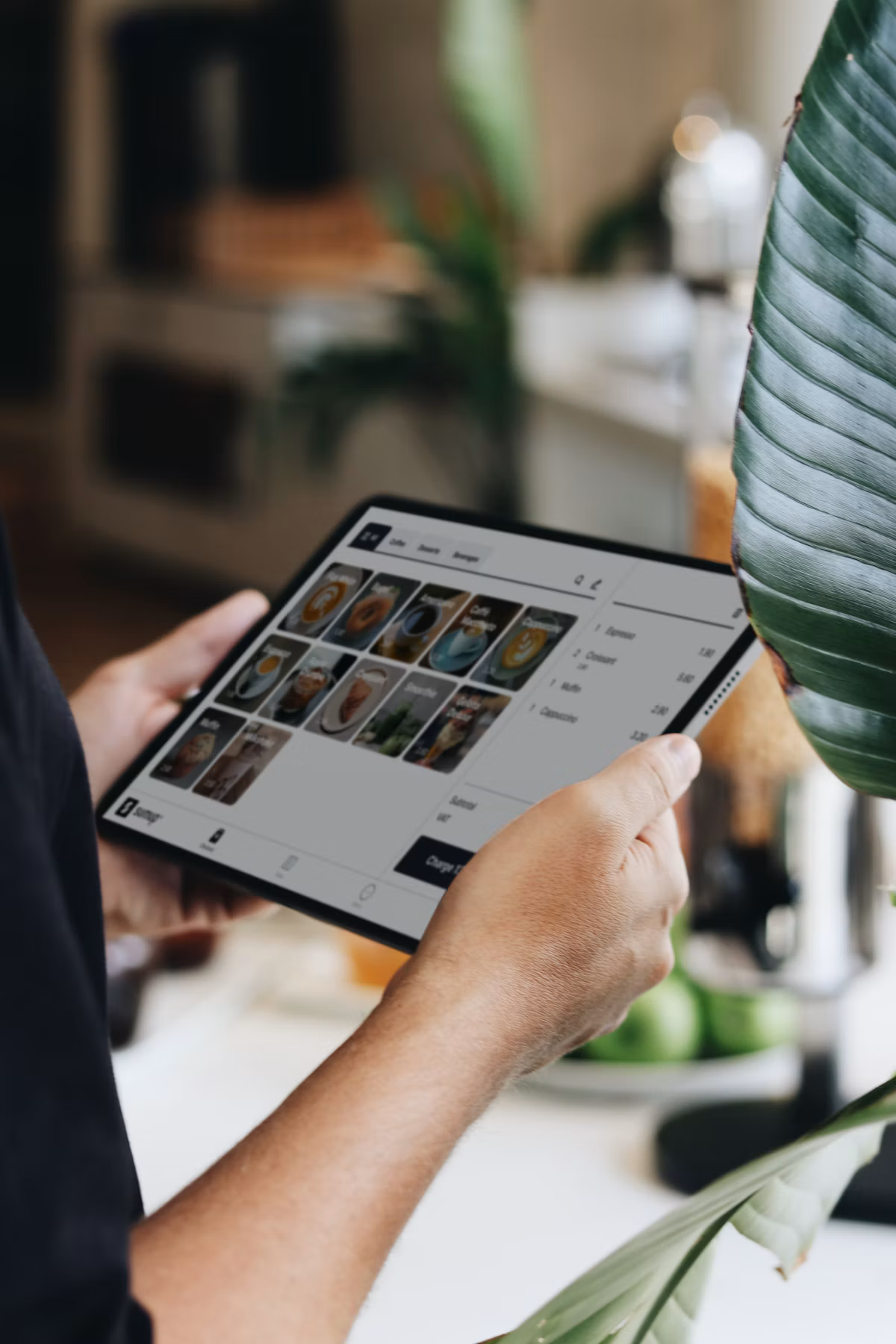 Store associate reviewing live sales and stock analytics on a tablet