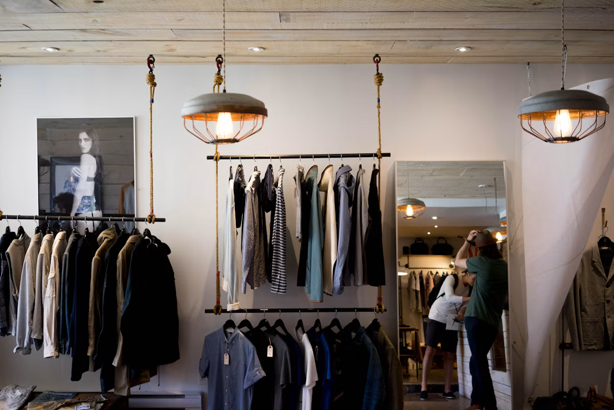Sunlit boutique interior with garment racks a shopper can browse virtually